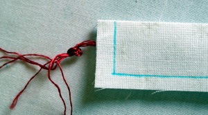 Sew along short edge to secure cord.