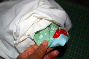 Pull santa sack right side out through opening in lining.